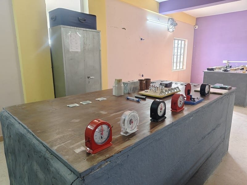 Students conducting physics experiments at Dunes Academy Phalodi laboratory
