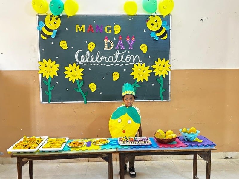 Students celebrating Mango Day at Dunes Academy