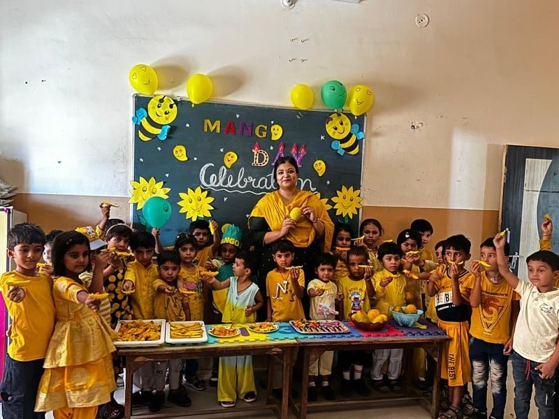 Students enjoying Mango Day activities at Dunes Academy