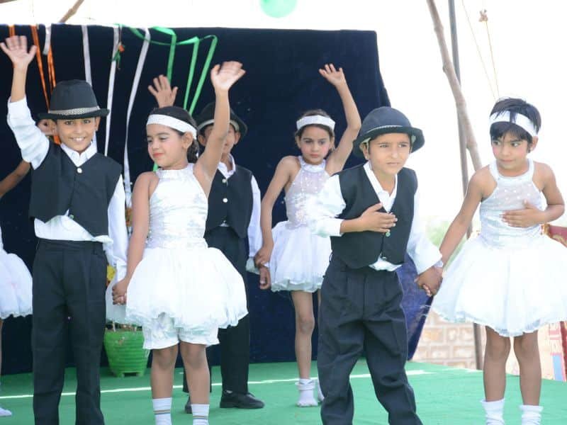Students performing on stage at the Dunes Academy annual function