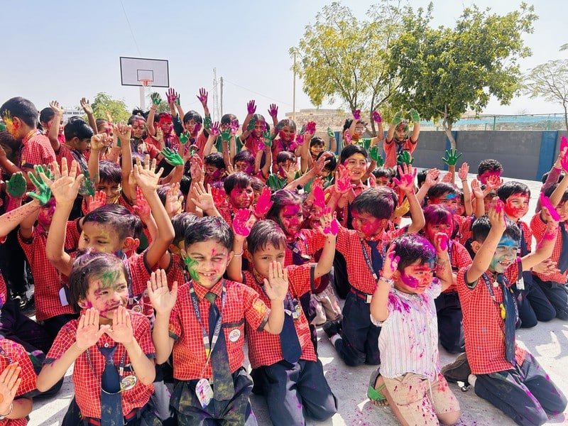 Students celebrating Holi at Dunes Academy